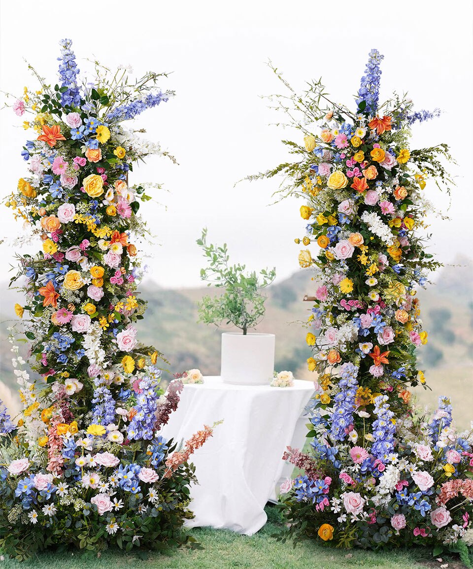 silk flower arrangements in brass vase